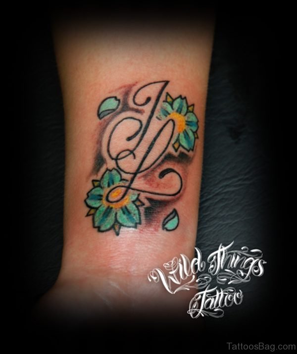 Colored Letter Tattoo On Wrist 