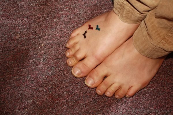 Colored Little Bat Tattoo On Foot