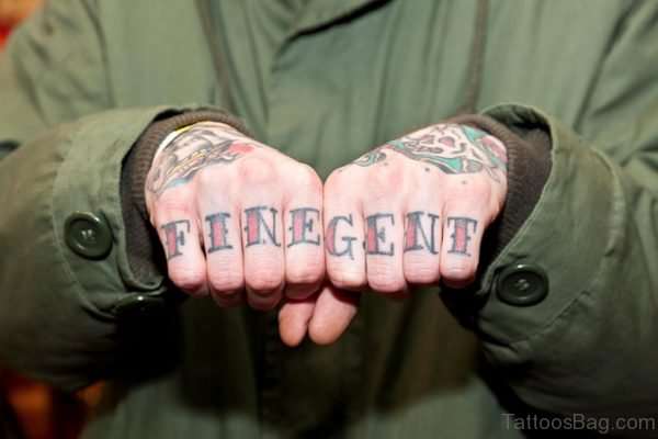 Colored Word Tattoo On knuckle