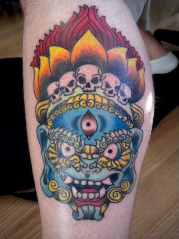 Colorful Thai Mask Tattoo On Leg