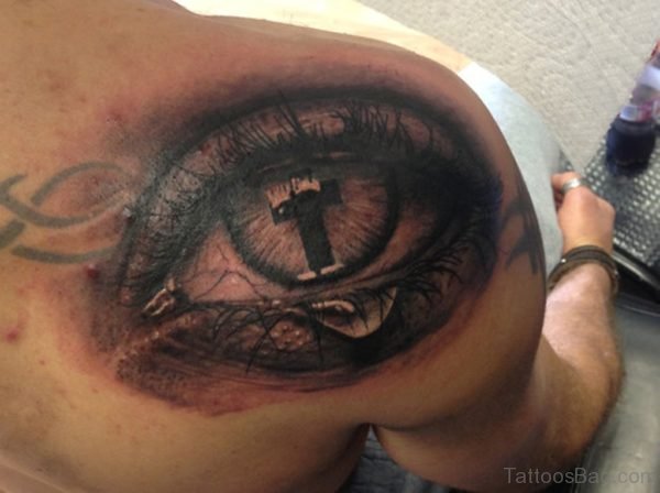 Cross Eye Tattoo On Back Of Shoulder