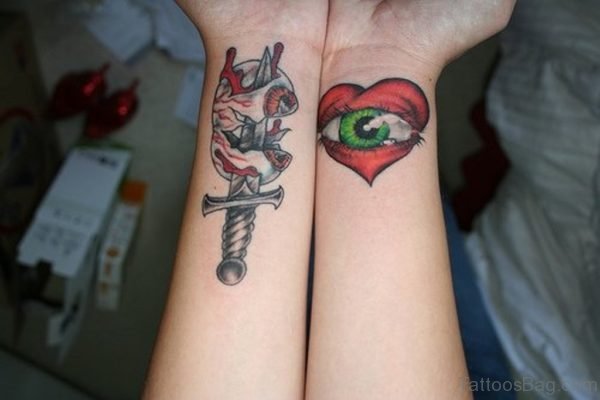 Dagger And Eye Tattoo On Wrist