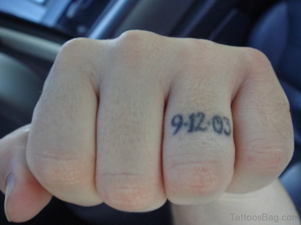 Dates Tattoo on Ring Finger 