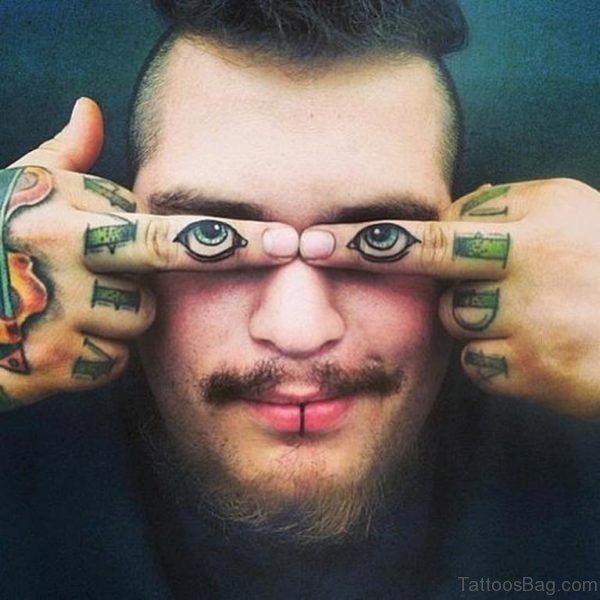 Eyes Tattoo On Finger