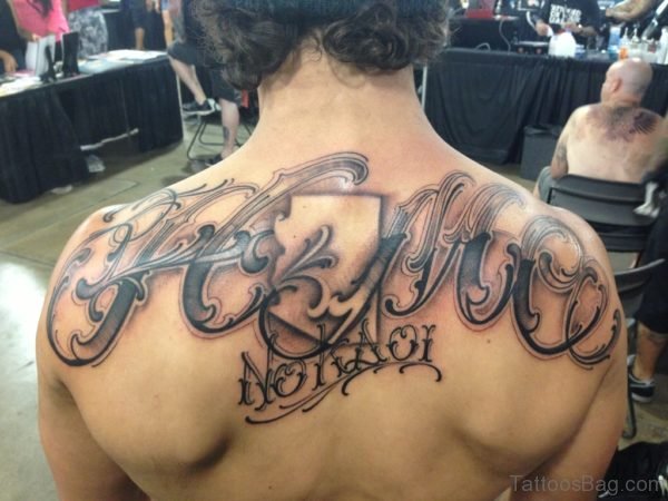 Fantastic Lettering Tattoo On Upper Back