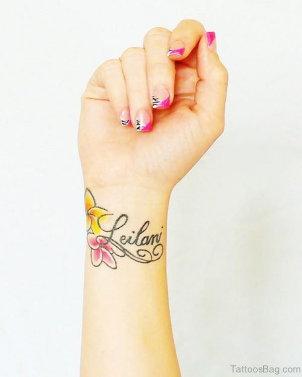 Flower And Word Tattoo On Wrist 