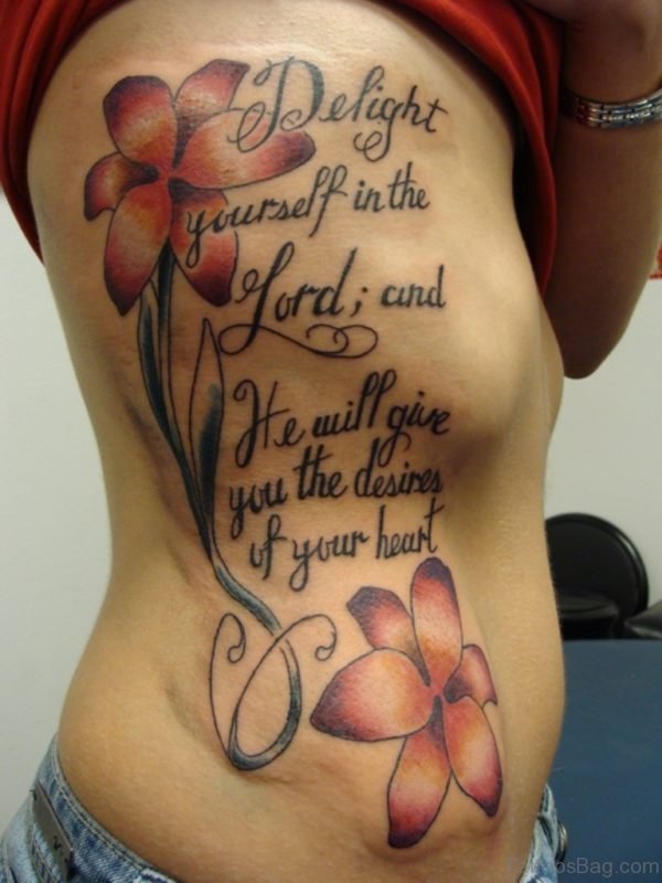 Flower And wording Tattoo On Rib 