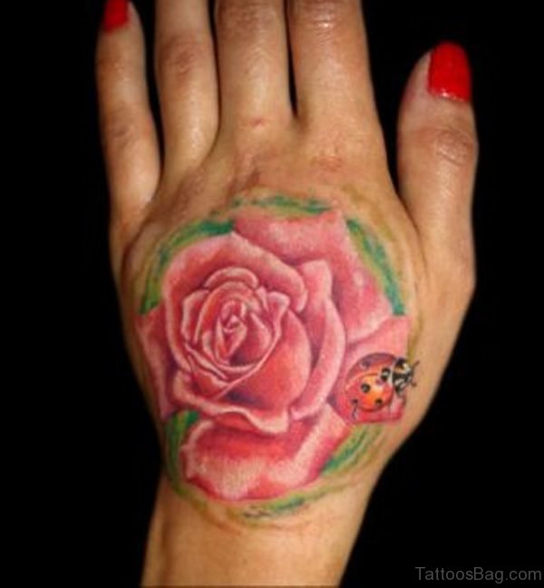 Flower Lady Bug Tattoo On Hand
