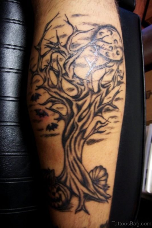 Flying Bat And Spooky Tree Tattoo On Leg