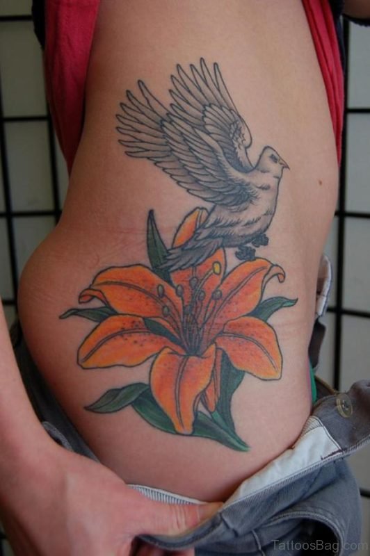 Flying Bird With Orange Lily Tattoo On Waist