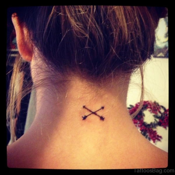 Girl With Cross Arrow Tattoo On Nape