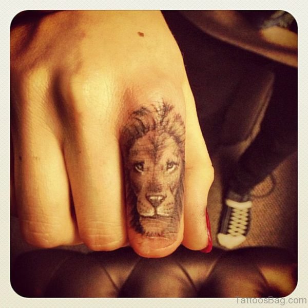 Gorgeous Lion Face Tattoo On Finger