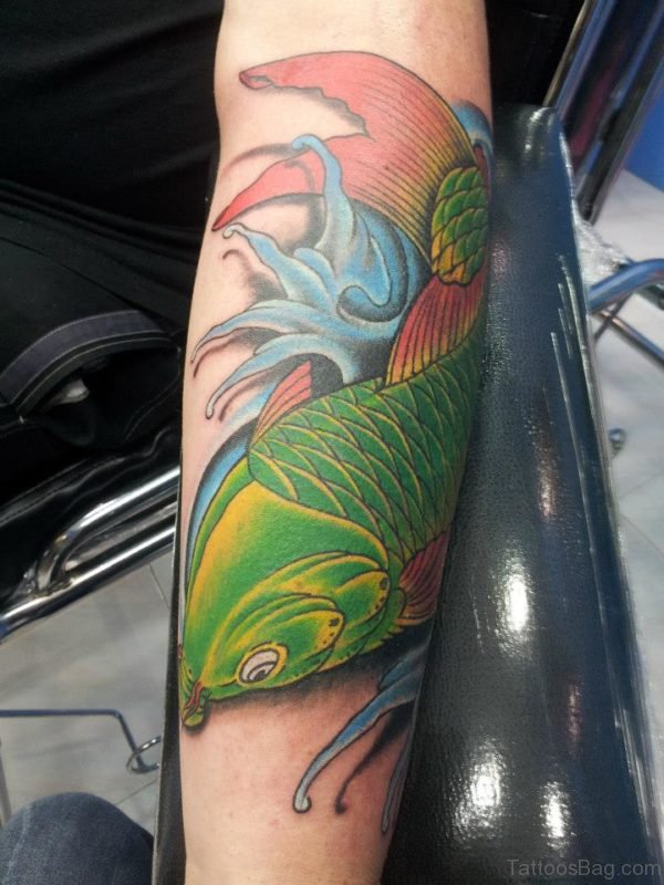 Green Fish Tattoo On Arm 