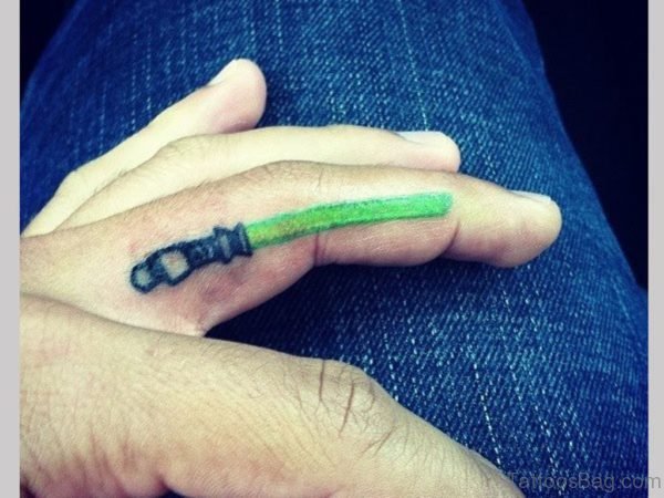 Green Sword Tattoo On Middle Finger