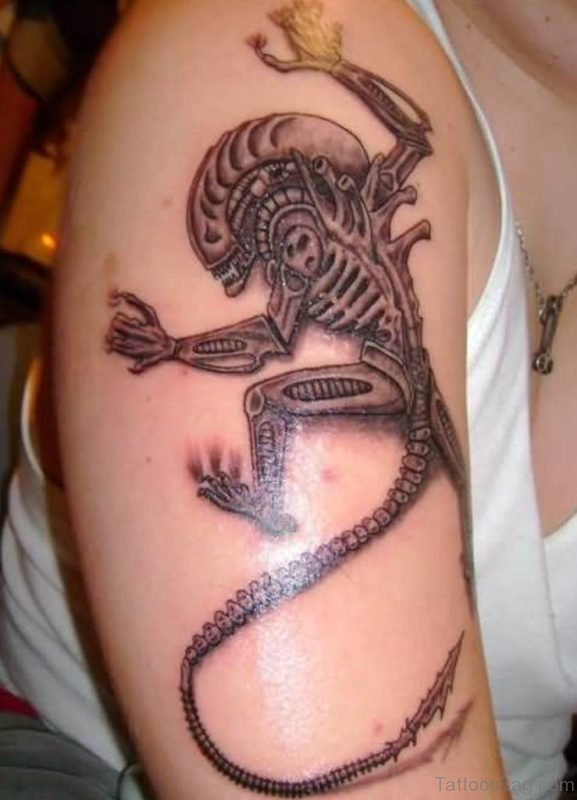 Grey Ink Alien Tattoo On Shoulder