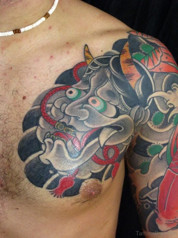 Grey Ink Japanese Mask Tattoo On Chest
