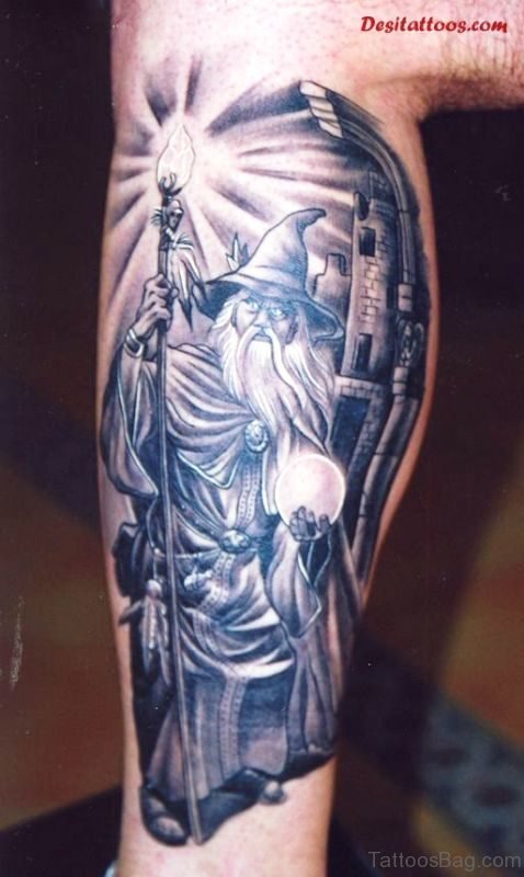 Grey Ink Viking Fantasy Tattoo On Calf