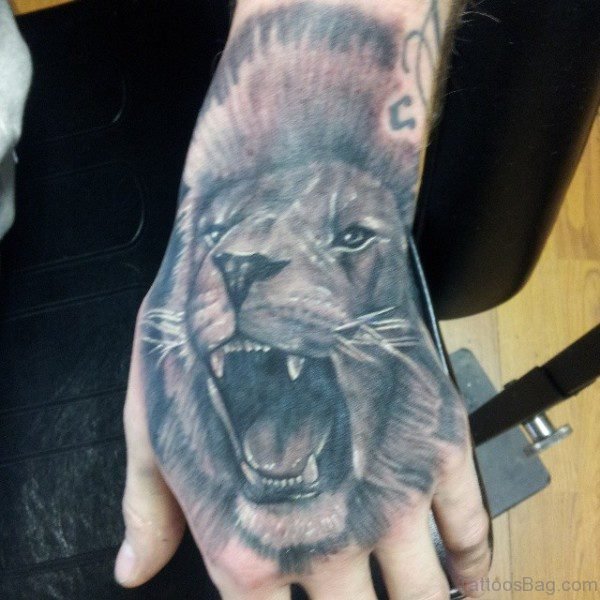 Grey Lion Head Tattoo On Hand