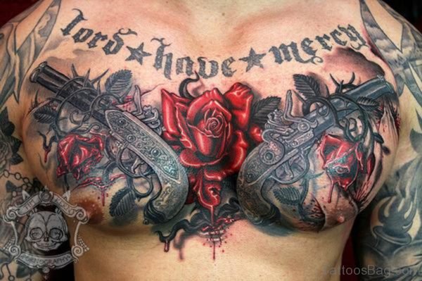 Gun And Rose Tattoo On Chest