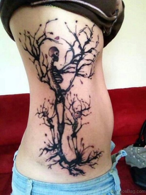 Halloween Tree With Two Skeleton Tattoo On Side Rib