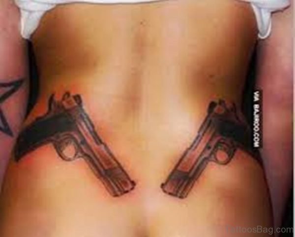 Impressive Gun Tattoo On Waist