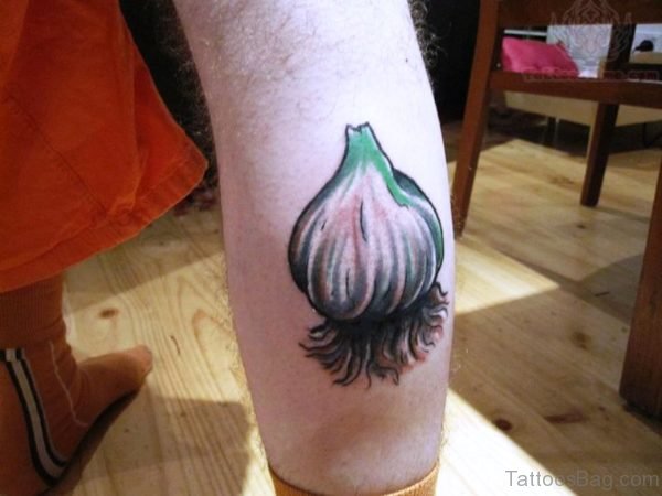 Large Garlic Tattoo On Calf