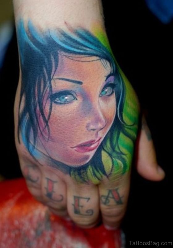 Lovely Face Portrait Tattoo On Hand 
