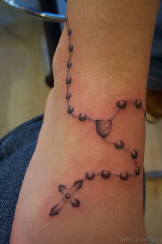 Nice Cross Ankle Tattoo