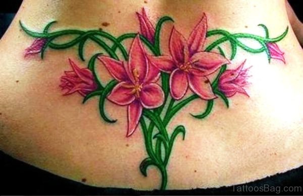 Pink Flowers Vine Tattoo On Lower Back