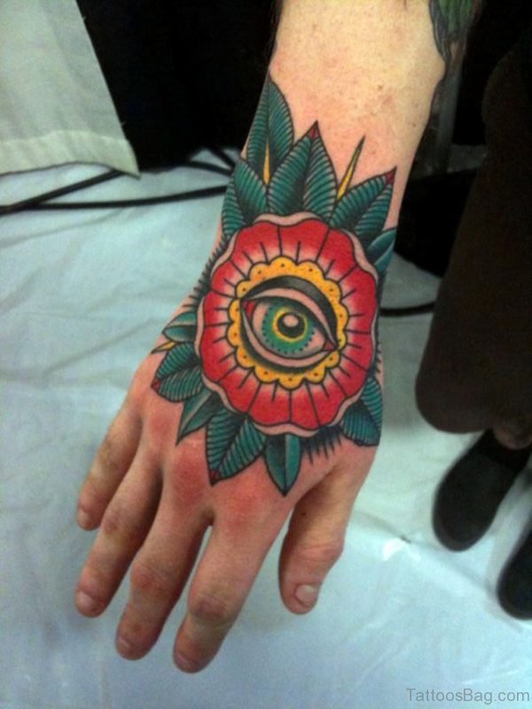 Red Flower And Eye Tattoo On Hand