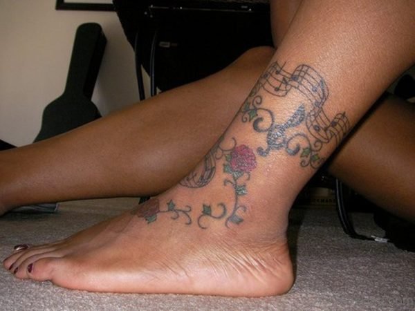 Red Rose And Music Notes Tattoo On Ankle