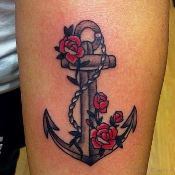 Red Rose Flower And Anchor Tattoo On Man Left Arm