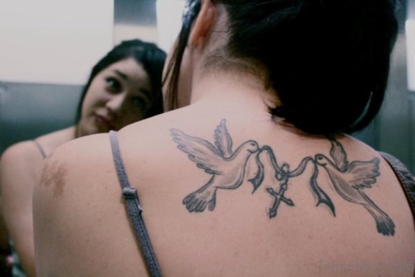 Rosary And Dove Tattoo On Upper Back