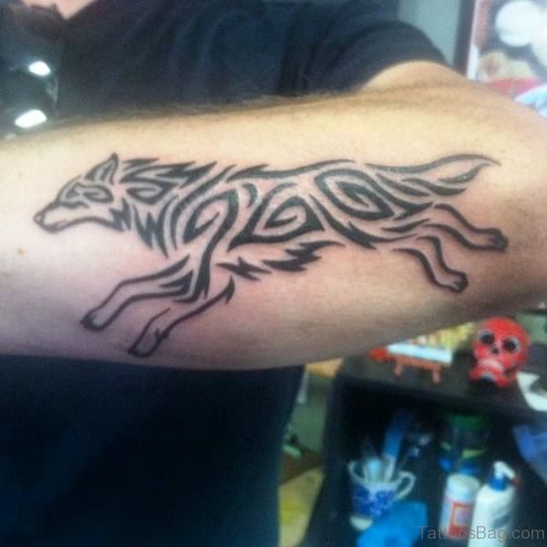 Running Tribal Alpha Wolf Tattoo On Arm