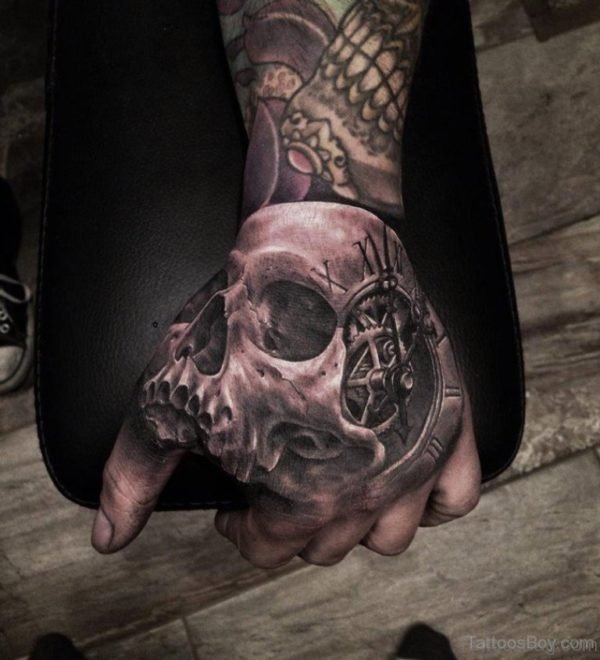 Skull And Clock Tattoo On Hand