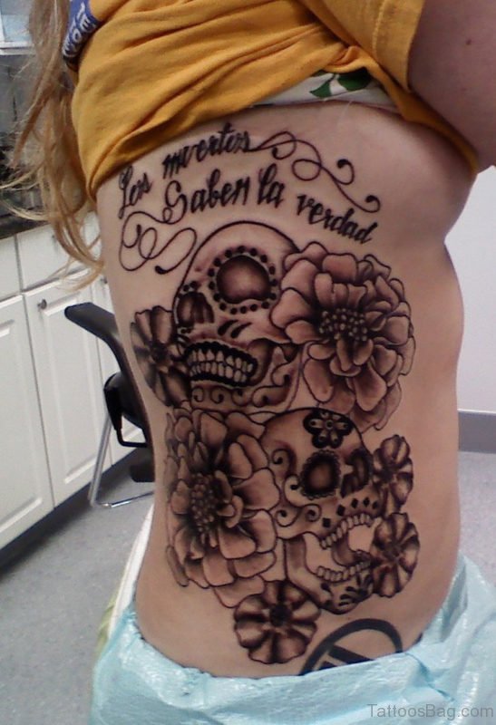 Skull And Flower Tattoo On Rib 