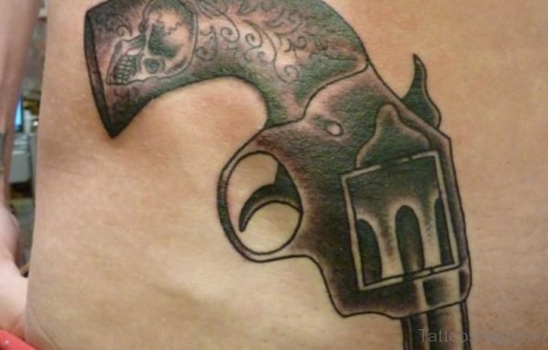 Skull Handgrip Gun Tattoo On Waist