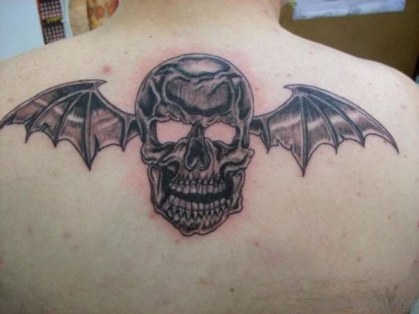 Skull With Bat Wings Tattoo On Upper Back