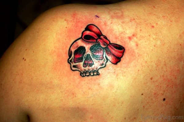 Skull With Bow Tattoo On Back Shoulder