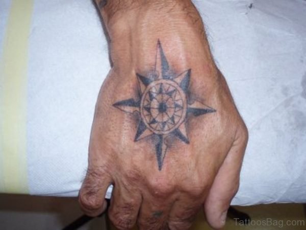 Small Size Grey Compass Tattoo On Hand