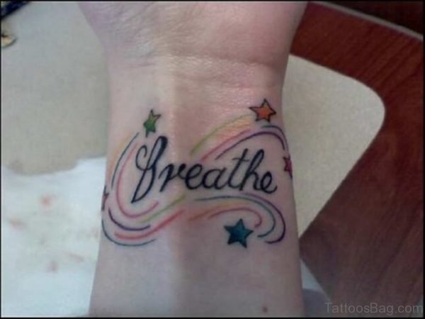 Stars And Breathe Tattoo On Wrist 