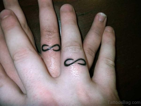 Symbol Tattoo On Finger 