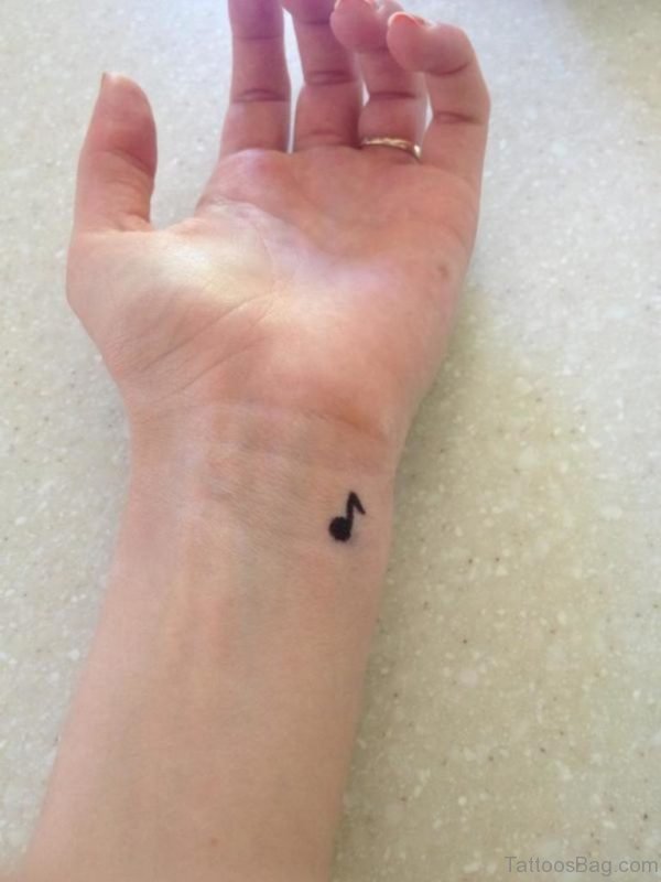 Tiny Music Note Tattoo On Wrist 