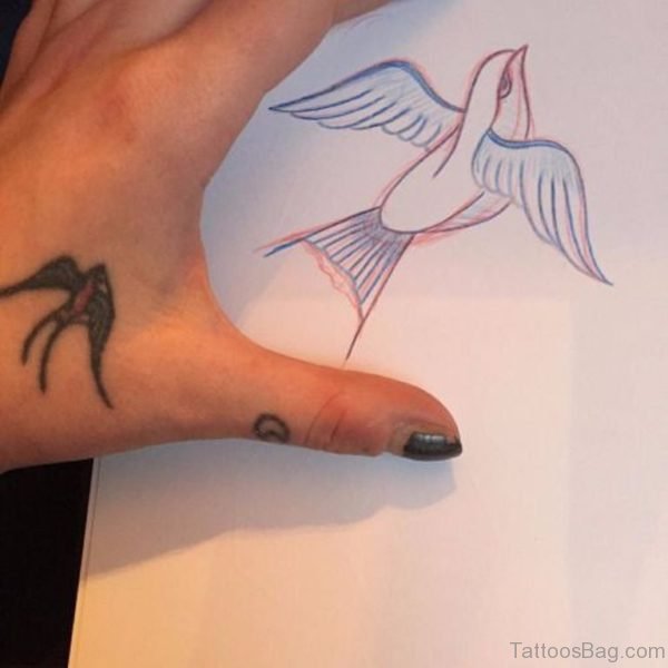 Tiny Swallow Tattoo