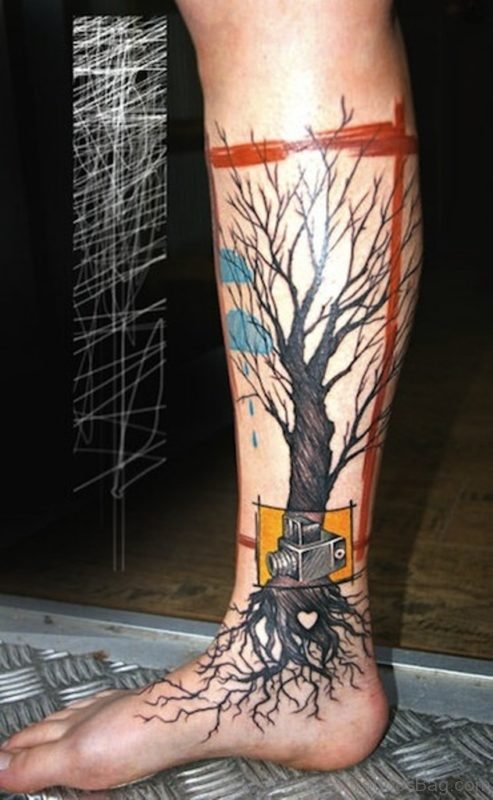 Tree Without Leaves With Camera Tattoo On Leg