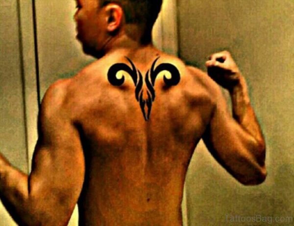 Tribal Aries Tattoo On Upper Back