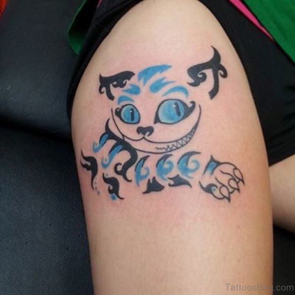 Tribal Cheshire Cat Tattoo On Thigh