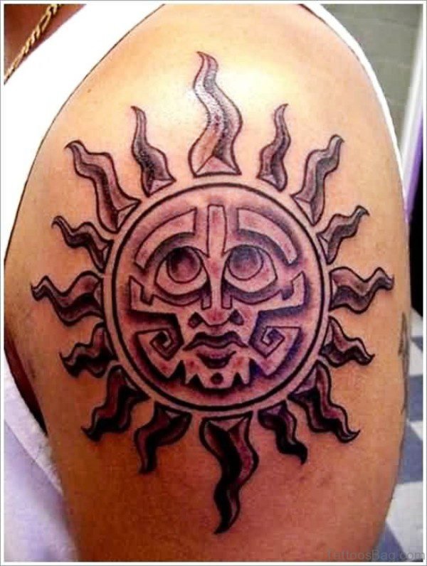 Tribal Style Sun Tattoo On Shoulder