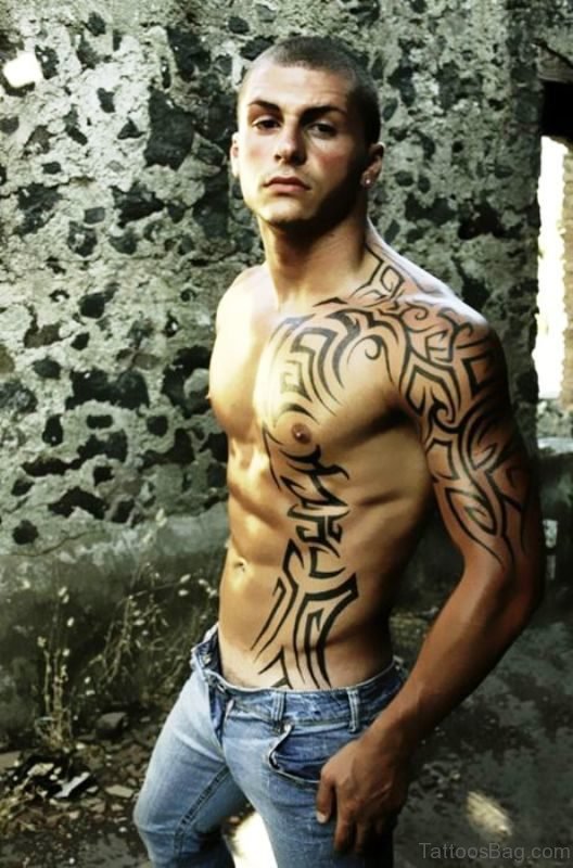 Tribal Tattoo On Chest And Arm