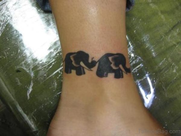 Two Black Elephnat Tattoo On Ankle